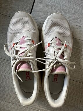 On Running Women’s Cloudflow Sneakers in White with Pink Accents